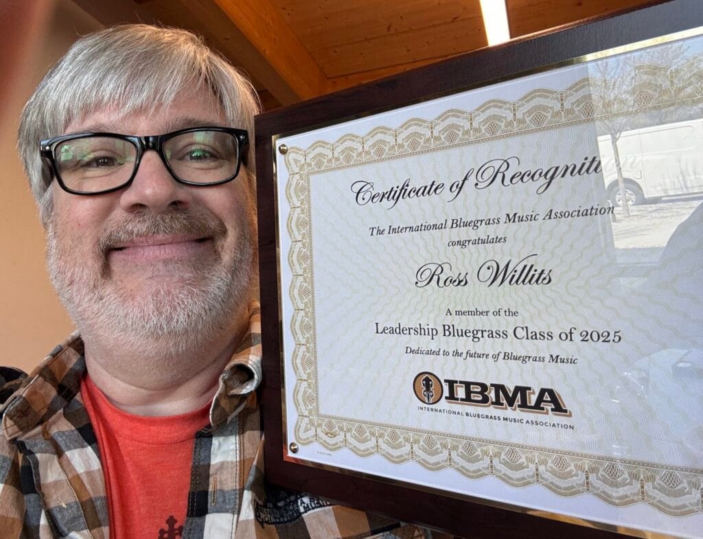 Ross Willits holding a plaque recognizing his completion of the Leadership Bluegrass Program